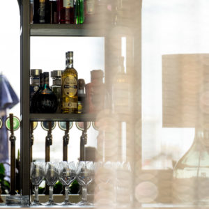 liquor bottles behind curtain in bar in Wynyard Quarter